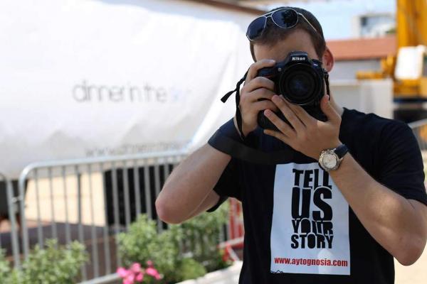 Dimitris Vakri holding a camera